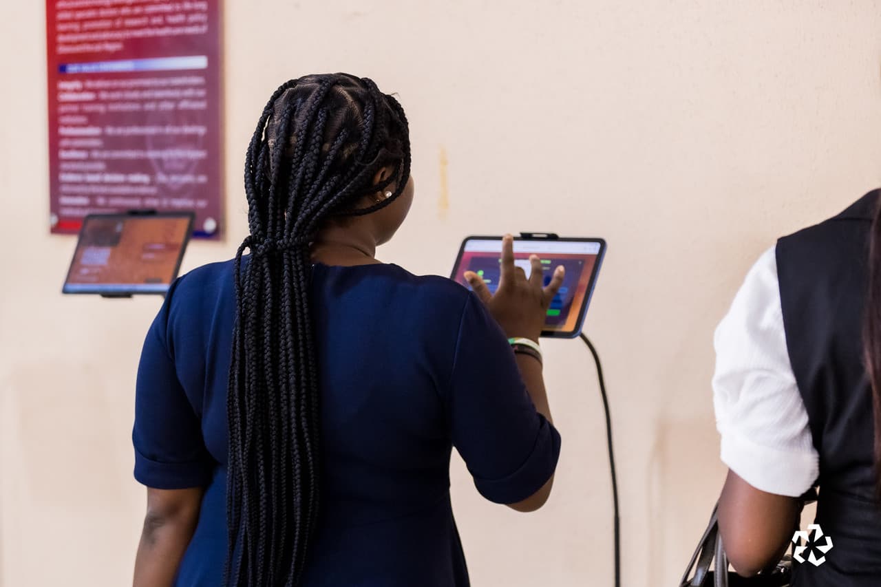 Attendee completing event registration and check-in at corporate conference in Accra, Ghana: Asterixify event management